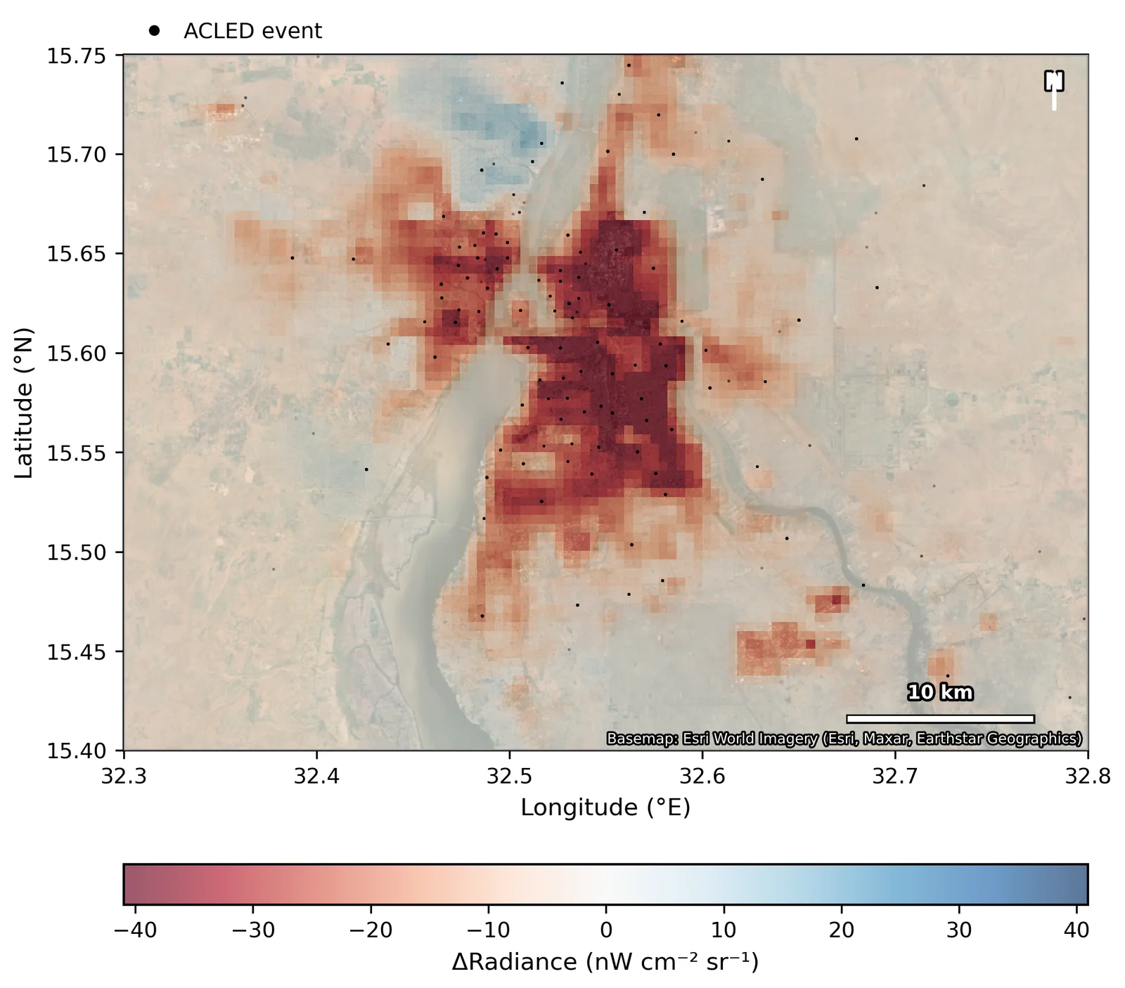 Map of night-light change in Khartoum between 2022 and 2024, with deep dimming over the urban core and conflict events as dots.